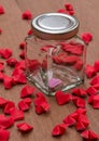 Pink hearts in dozen covered With a red paper heart surrounded on the table