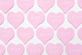 Pink hearts with text LOVE, KISS, FOREVER YOURS on white background. Valentines day texture or wallpaper. Gift for lover, love