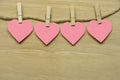 Pink Hearts are with wooden clamps and clamp. Hanging on wooden
