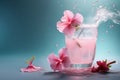 pink hibiscus cocktail with splashing water on blue background Royalty Free Stock Photo