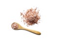 Pink Himalayan organic salt in an eco-friendly little wooden spoon top view, isolated object, healthy dieting