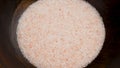 Pink Himalayan Salt Fine Grain In Wooden Bowl. Rotation.