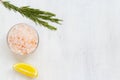 Pink Himalayan salt on the glass bowl, Bay leaf, piece of lemon, fresh garlic and mix of peppers Royalty Free Stock Photo