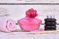 Pink himalayan salt with towel and black stones. Royalty Free Stock Photo
