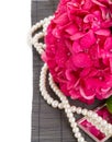 Pink hortensia flowers and pearls close up Royalty Free Stock Photo