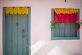 Pink house facade with bluish gray door and window. Royalty Free Stock Photo