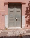 pink house weathered grey door at Plaka neighborhood, Athens Greece Royalty Free Stock Photo