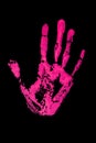 Pink human hand print on black background isolated close up, handprint illustration, palm and fingers silhouette mark, one hand