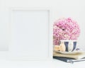 Pink hydrangea, tea and macaron empty frame mockup