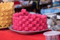 Pink Indian sweet desert cakes for sale at Thaipusam festival