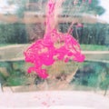 Pink ink drops in water Royalty Free Stock Photo