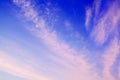 Pink ÃÂirrus clouds on blue sky background closeup, dawn cirrostratus cloud texture, evening sunset or morning sunrise clouds Royalty Free Stock Photo