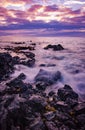Sunset on rocky shore of Hawaii