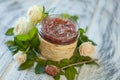 pink jam with rose petals-Rose petal jam in a glass jar on neutral grey kitchen table with copy space Royalty Free Stock Photo