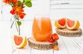 Pink juicy homemade grapefruit cocktail with alcohol over old vintage wooden table Royalty Free Stock Photo