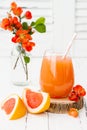 Pink juicy homemade grapefruit cocktail with alcohol over old vintage wooden table Royalty Free Stock Photo