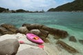 Pink kayak on coral beach