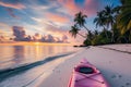 pink kayak on tropical beach, palm trees, sunset Royalty Free Stock Photo