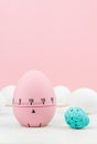 Pink kitchen egg timer on a pink background. cooking time, soon Easter Royalty Free Stock Photo