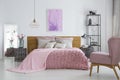 Knit blanket in feminine bedroom