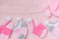 Pink knit hat and socks gift set for a newborn baby girl on knit Royalty Free Stock Photo