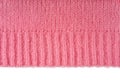 Pink knitted woolen jersey fabric, sweater texture with edge isolated on white background Royalty Free Stock Photo