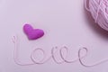 pink knitting yarn to form the word love. Royalty Free Stock Photo