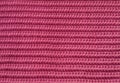 Pink knitwear fabric texture.