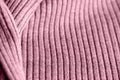 Pink knitwear texture close-up. Textile background