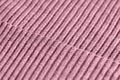 Pink knitwear texture close-up. Textile background