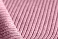 Pink knitwear texture close-up. Textile background