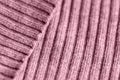 Pink knitwear texture close-up. Textile background