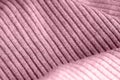 Pink knitwear texture close-up. Textile background