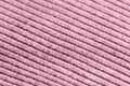 Pink knitwear texture close-up. Textile background