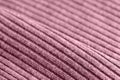 Pink knitwear texture close-up. Textile background