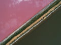 Pink lake Sasyk Sivash. The road dividing the coast. Taken from the drone