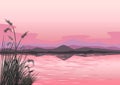 Beautiful pink landscape with sunset over the sea, mountains and reeds Royalty Free Stock Photo