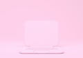 Pink laptop with blank screen mockup on pink background