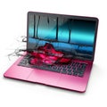 a pink laptop with a splash of water on it