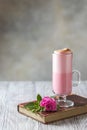 Pink Latte Tea. Pink hibiscus latte. Fashionable romantic drink. Dry flowers of roses. Pink background Royalty Free Stock Photo