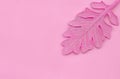 Pink leaf on paper background. Fashion minimal pop art style.