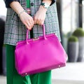 Pink leather bag in female hands. Stylish modern and feminine image, style. Bag close up Royalty Free Stock Photo