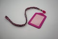 Pink leather card holder with detachable weaving neck strap in d