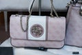 Pink leather hand bag by Guess in a luxury fashion store showroom