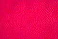 Pink leather surface under high magnification close detail photography as texture background