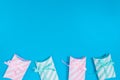 pink and light green gift boxes placed on a blue background located bottom of the picture Royalty Free Stock Photo