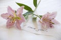 Pink lillies and a love you note Royalty Free Stock Photo