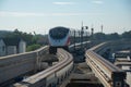 The Pink Line electric train runs on train track