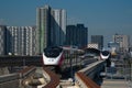 The Pink Line electric train runs on train track