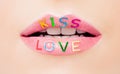 Pink lips with glossy lipstick. Open mouth with white teeth. Valentine`s day, love and passion concept